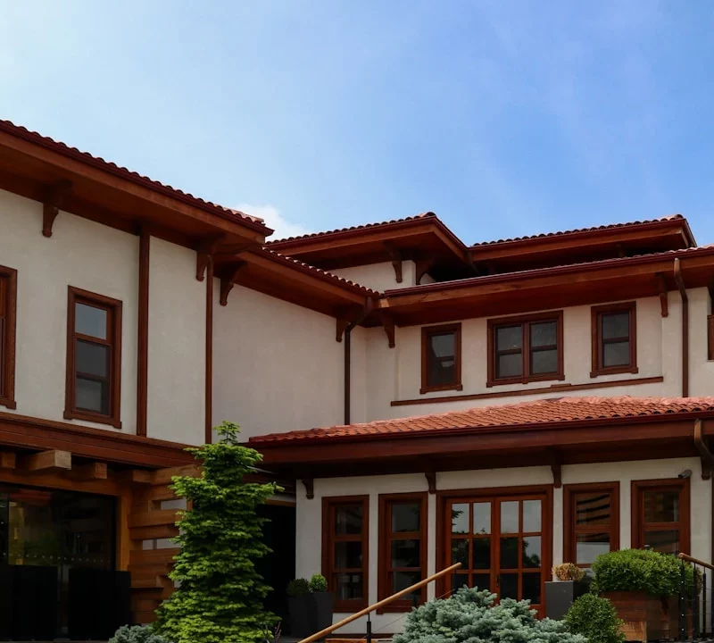A large white house with a red roof